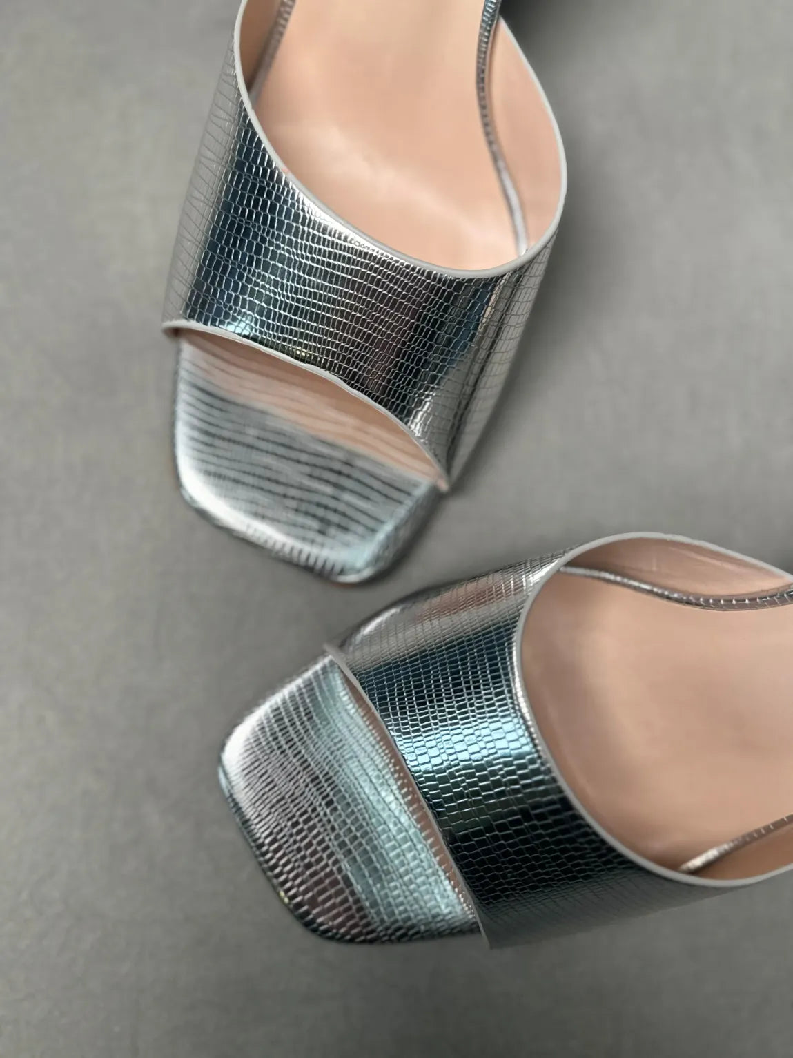 Close-up of Silver Snakeskin High Heel Mules with Metallic Shine