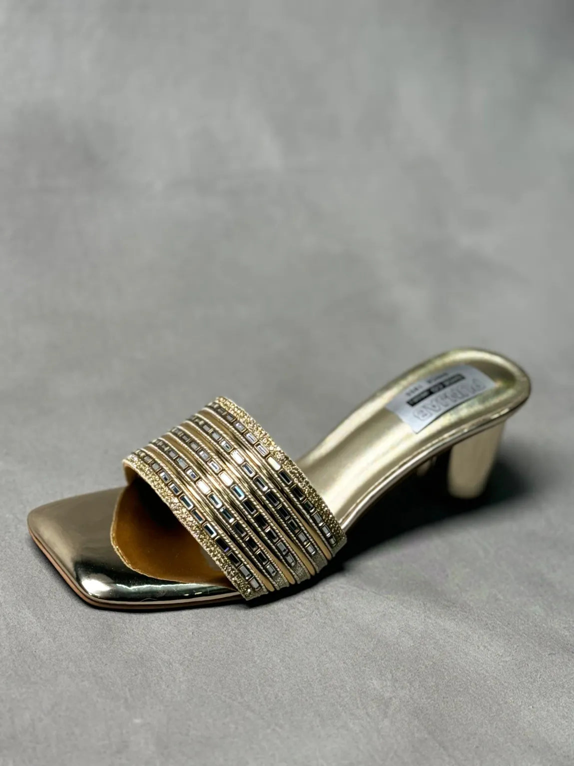 Side view of Embellished Golden Metallic Mules with intricate detailing, perfect for evening wear.