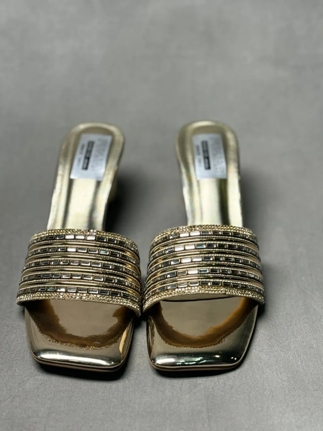 Top view of Embellished Golden Metallic Mules with intricate embellishments, designed to elevate evening wear.