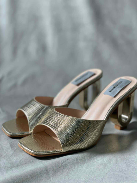 Side view of Golden Snakeskin Pattern Heels for women, showcasing the shimmering finish and intricate design.
	