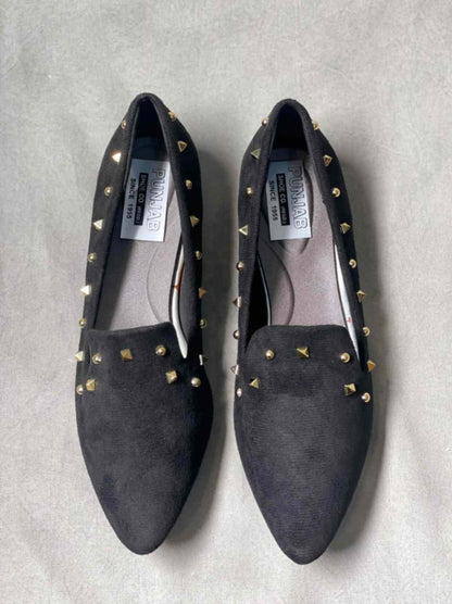 Top view of black suede loafers with subtle detailing, perfect for casual or semi-formal occasions.