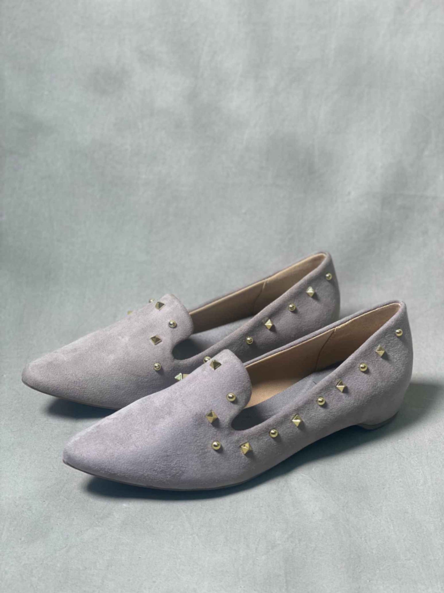 Grey suede loafers for women, ideal for pairing with casual office outfits or weekend wear.

