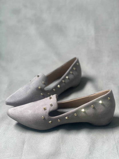 Side view of grey suede loafers for women, showcasing their sleek, slip-on design.